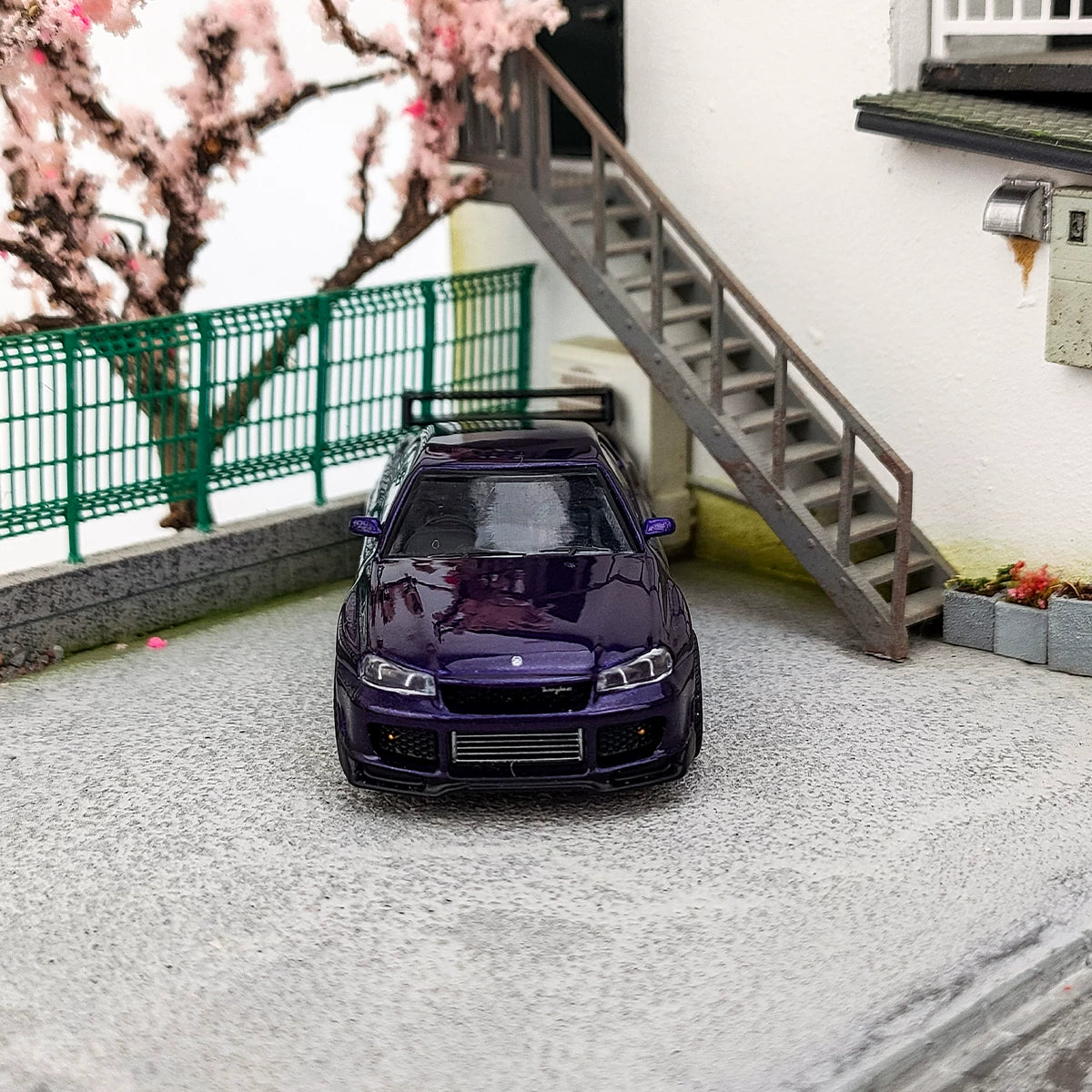 MINI GT 1:64 Nissan Skyline GT-R (R34) Tommykaira – Midnight Purple Edition