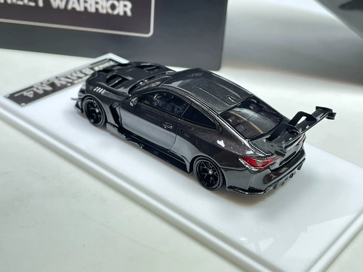 Street Warrior TMCS BMW M4 1:64 carbon-fiber style diecast alternate rear three-quarter view