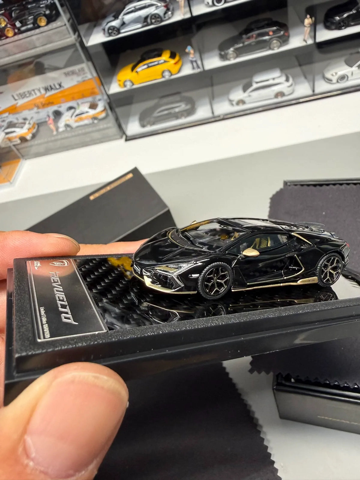 LCD Models Lamborghini Revuelto black gold limited edition 1:64 diecast front three-quarter view