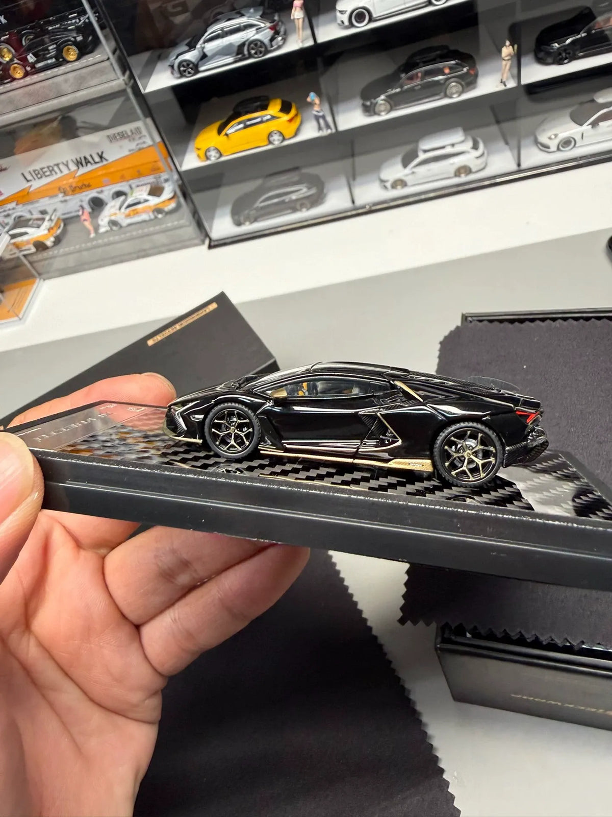 LCD Models Lamborghini Revuelto black gold limited edition 1:64 diecast side profile