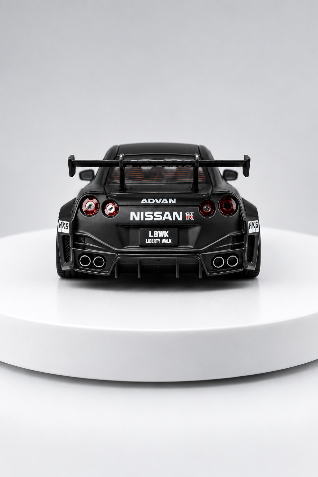 Nissan GT-R 35GT-RR LBWK matte black 1:64 diecast rear studio view