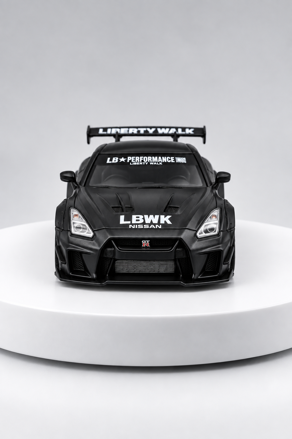 Nissan GT-R 35GT-RR LBWK matte black 1:64 diecast front studio view