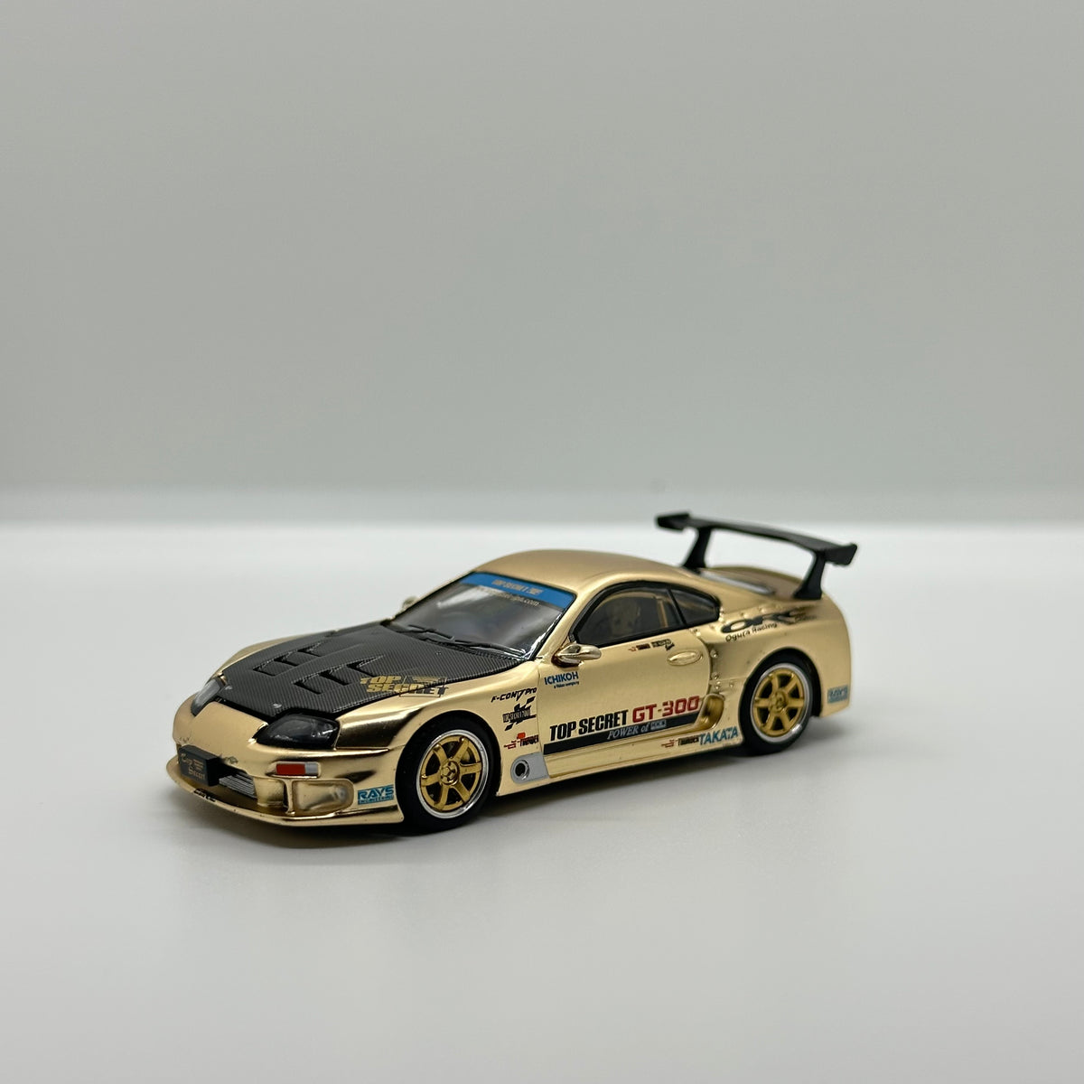 POP RACE PR64-277 Top Secret GT300 Supra gold 1:64 diecast front three-quarter view