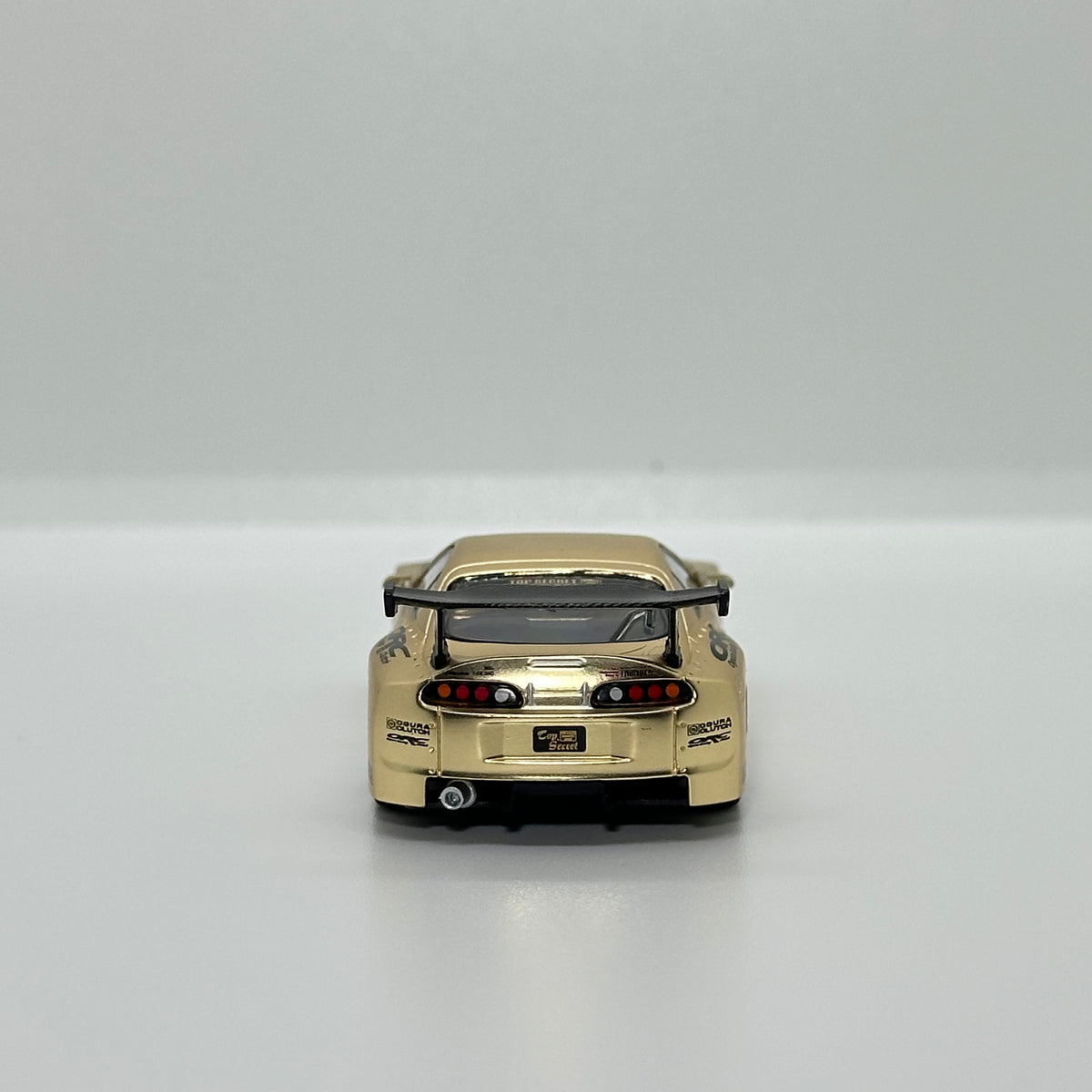 POP RACE PR64-277 Top Secret GT300 Supra gold 1:64 diecast rear view